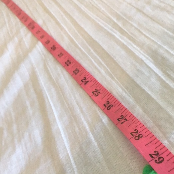 Lolli White cotton cover up with multi colored fringe. - Picture 6 of 7